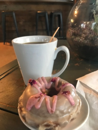 Rose Chai donut with a cup of coffee